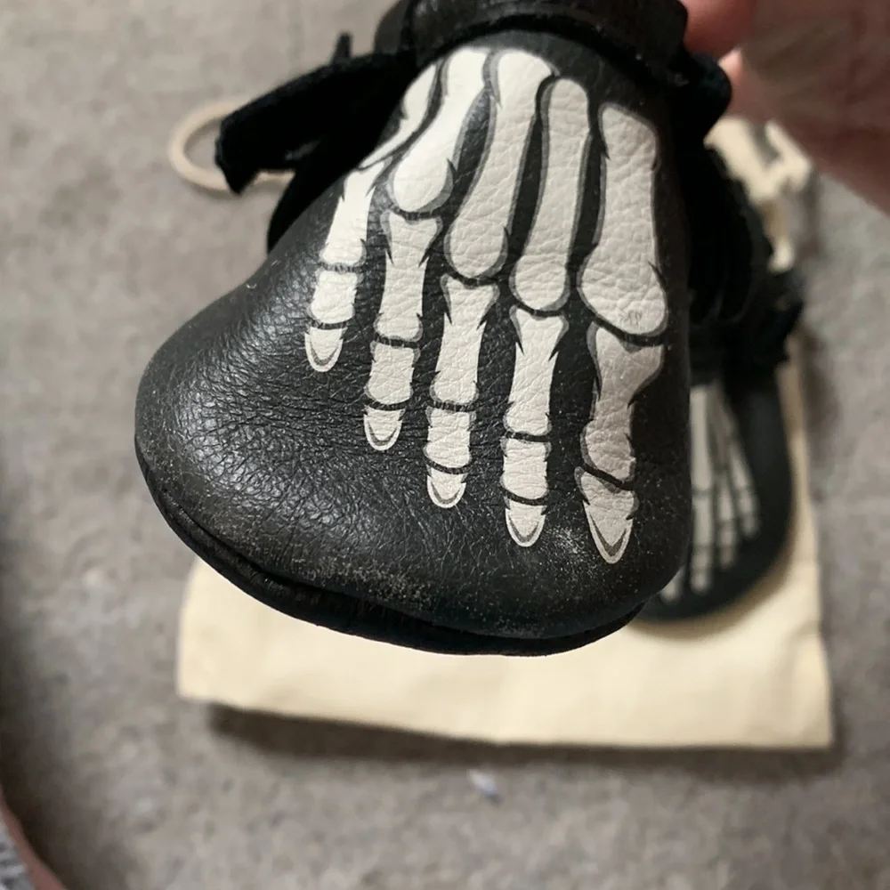 Freshly Picked Black Moccasins with White Skeleton Print